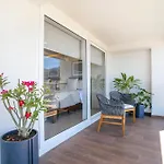 Upscale Corner Unit With Large Wrap Around Balcony And Pools